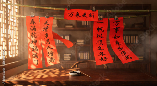 Freshly written red spring couplets drying on bamboo pole in warm sunlight