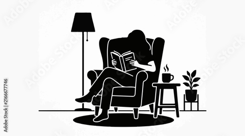 Silhouette of a person reading a book in an armchair