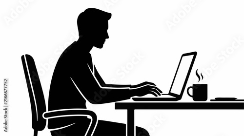 Silhouette of a man working on a laptop at a desk