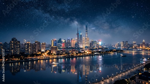 Shanghai skyline reflects in the water under a starry night sky