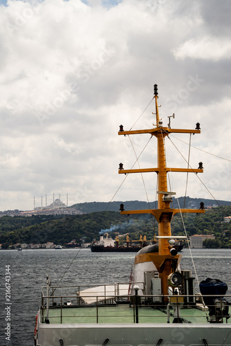 Obraz na płótnie Yellow ship signal mast on passenger ferry deck with Bosphorus sea and Camlica Mosque in background