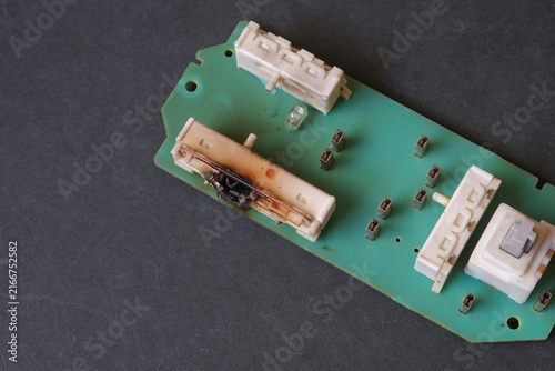 An electronic part from an industrial machine that burned out due to a short circuit.