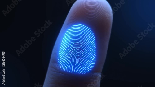 Fingerprint scan illuminates fingertip with blue biometric pattern in dark setting