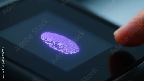 Fingertip Touching Dark Touchscreen in Extreme CloseUp With Visible Finger Reflection