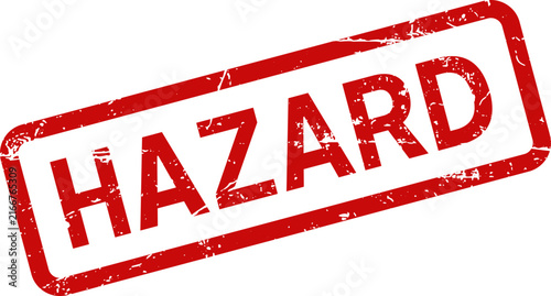A red ink rubber stamp impression with the word hazard printed on a clean white background surface