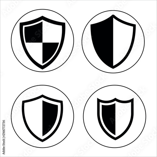 Set of four black and white shield icons in a circular frame, vector illustration