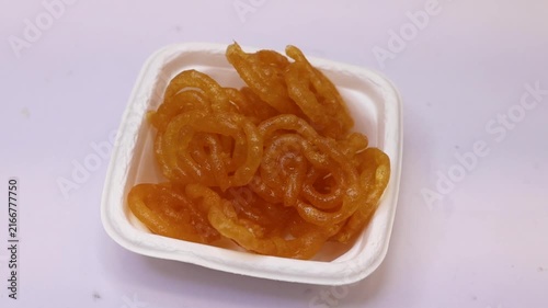 Imarti or jalebi an indian dessert fried in oil then dipped in sugar syrup