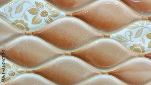 Beige and brown petal shaped ceramic tiles with golden floral motifs