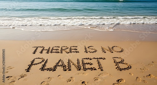 There Is No Planet B text written in sand on a beach for environmental awareness concept.