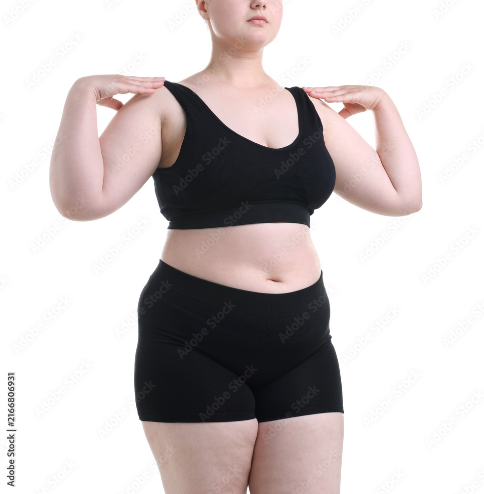 Fototapeta premium Weight loss. Overweight woman on white background, closeup
