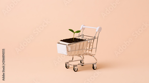 A small green seedling plant, scientifically known as Plantae, sitting inside a miniature metal shopping cart on a solid light beige background