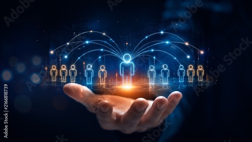 Conceptual digital networking and leadership showing human icons connected over a hand on dark background