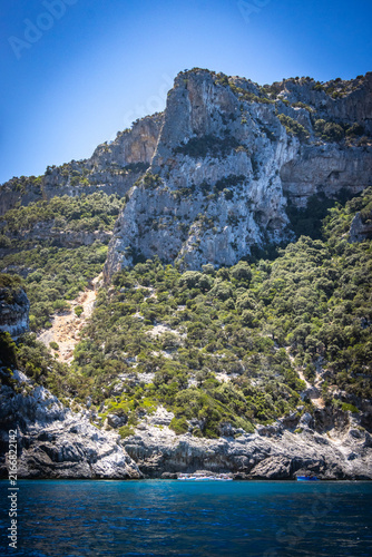 limestone cliffs and turquoise water, coast of baunei, gulf of orosei, sardinia, sardegna, italy, boats, mediterranean sea, vacation