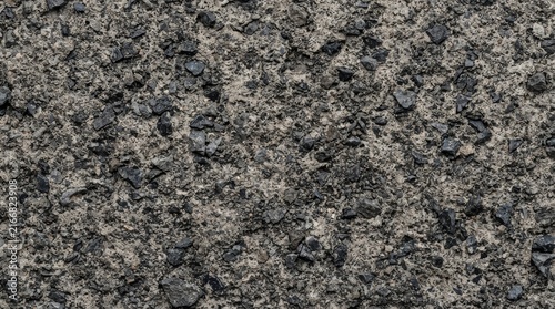 Close up view of rough gray and black gravel aggregate texture