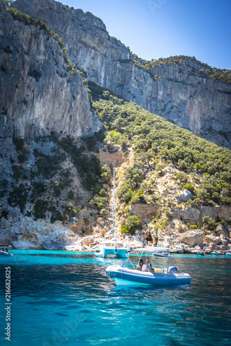 piscine di venere, venus pools, limestone cliffs and turquoise water, coast of baunei, gulf of orosei, sardinia, sardegna, italy, boat, mediterranean sea, vacation