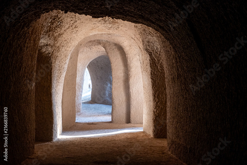 Bild auf Leinwand Light Shaft and Dust in Hand Carved Sand Tunnels Templo de Arena