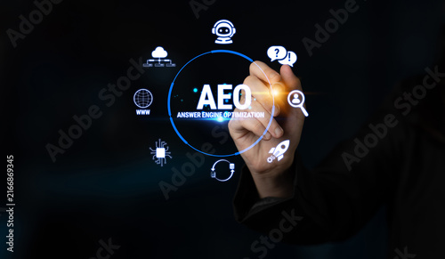 Photography Hand of a Business Person Touching a Virtual Screen Displaying Icons and Text Related to Answer Engine Optimization and Digital Marketing Strategies Fluxor