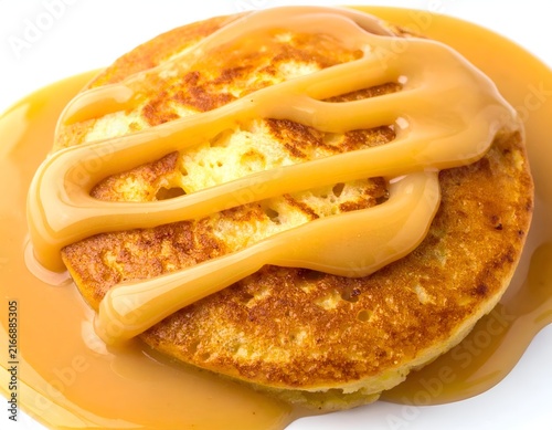 Pancakes drizzled with sweet caramel syrup.