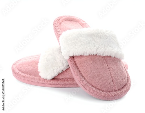 Pink fuzzy slippers with white faux fur lining.