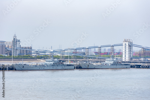 Photography Modern Chinese warships moored at a riverside quay near Shanghai, with the Yangtze River forming the surrounding maritime landscape