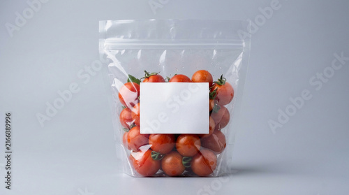 Mockup Cherry Tomato Packaging in Transparent Plastic Bag with White Label on Gray Background