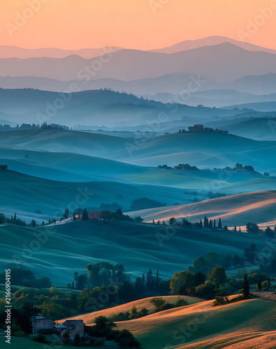 Rolling green hills fading into a misty pastel horizon — deep blue Tuscan-style valley