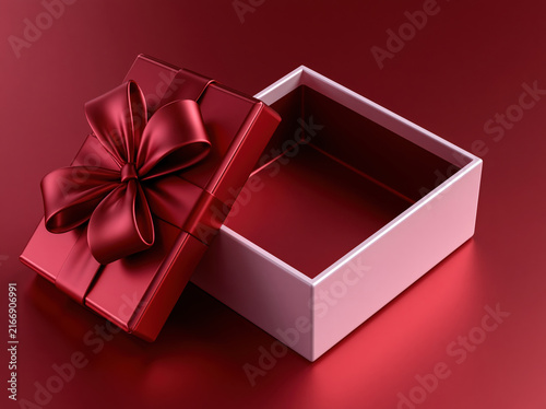 Red gift box with satin bow and open lid on red surface, creating elegant luxury presentation for holiday celebration, romantic occasion, special event, or product packaging