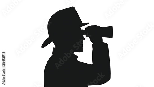 Silhouette of person filming with camera white background.