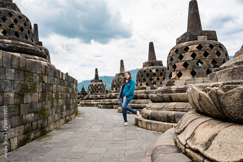 Konstfotografi Women with casual clothing style pose in front of stupa on Borobudur temple