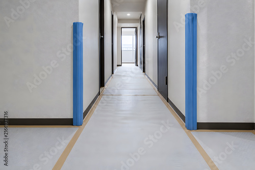 Protective floor sheeting in hallway