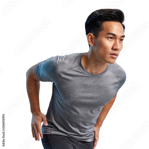 Asian man in grey t-shirt preparing to run isolated on a transparent background