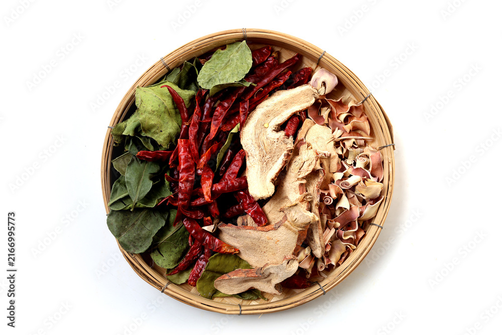 Naklejka premium Collection of dried Tom Yum herbs including galangal, lemongrass, chili, and kaffir lime leaves. Traditional Thai food ingredients