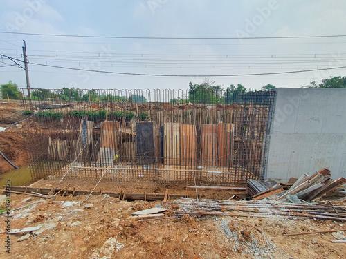 Construction site with steel reinforcement for concrete foundation.