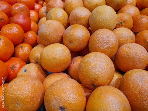Fresh Ripe Oranges and Mandarins in a Fruit Market Display.