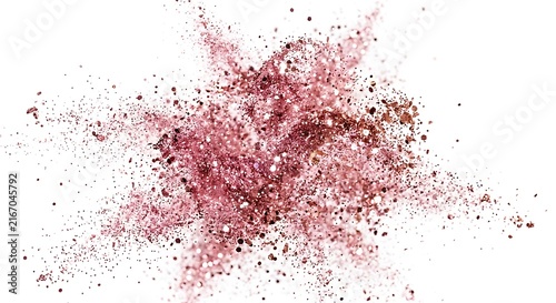 Pink glitter explosion with rose gold powder and sparkle particles on white.