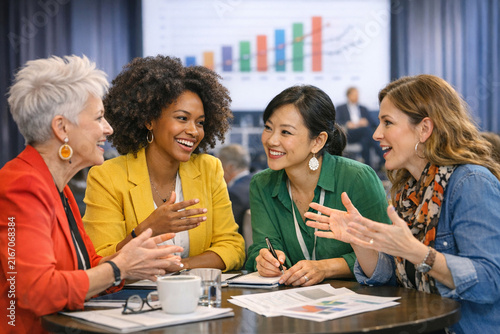 Smiling Women Discussing Business