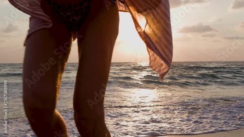 Concept of a summer beach vacation. young woman at the beach. feeling of freedom and summer rest. summer mood. moment of happiness.