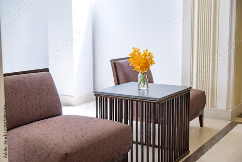 Elegant Modern Hotel Lobby Lounge Chair with Yellow Orchid Decoration