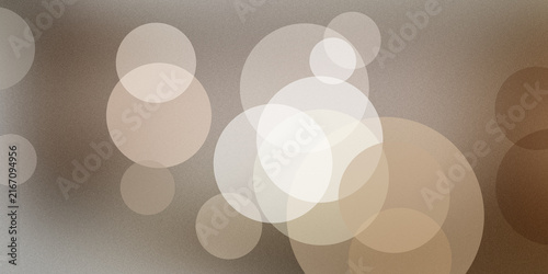 Warm beige glowing circular bokeh circles abstract textured backdrop for luxury design.