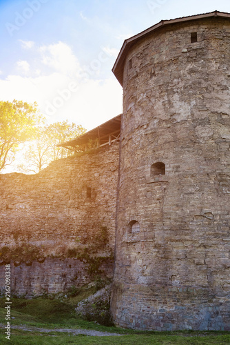 Canvastavla Tall Stone Tower of an Old Medieval Fortress Illuminated by Golden Sunlight Duri