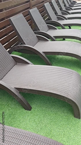 Close View of Empty Poolside Lounge Chairs