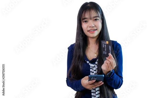 Woman is holding a credit card and a smartphone on white background