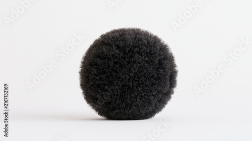 Dark scrubber rests on white backdrop