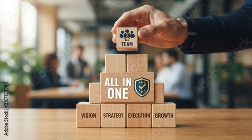 Stack of cardboard boxes with team and growth words on wooden table