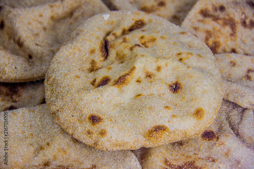 Egyptian baladi Bread Food Photography, breakfast, lunch, dinner,  traditional whole wheat flatbread known for its hearty texture and nutty flavor, selective focus, shallow depth of field, Cairo Egypt