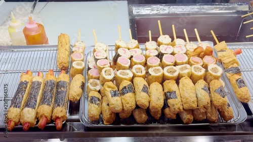 Korean Street Food – Assorted Corn Dogs with Potato Coating, Mozzarella Cheese and Sausage Fillings at Night Market Stall