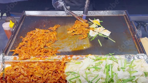 Korean Street Food – Spicy Stir-Fried Chicken Feet with Red Chili and Fresh Cabbage at Myeongdong Night Market in Seoul