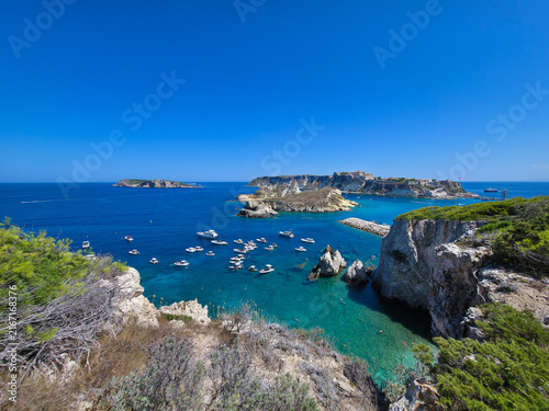 Panoramic View of Cala dei Pagliai in Tremiti Islands, San Domino and San Nicola Island, Apulia, Italy – Turquoise Sea with Boats and White Rocky Cliffs Under Blue Sky
