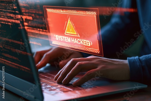 Cybersecurity threat - hacker attacking computer system with warning message.