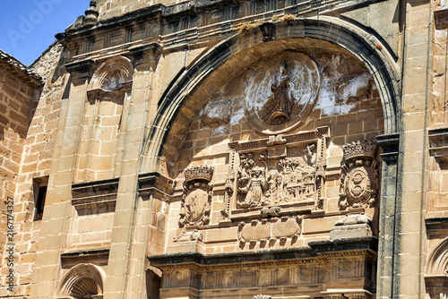 Fotografie Ornate historic stone portal with carved heraldic shields, figurative relief and